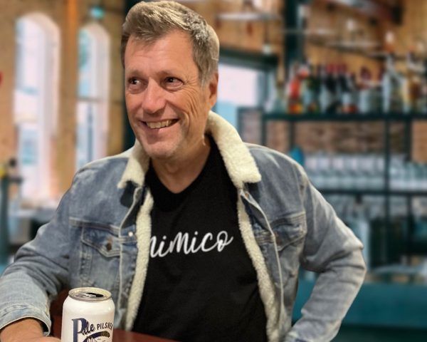 Handsome dude in a tshirt that says Mimico in a nice script